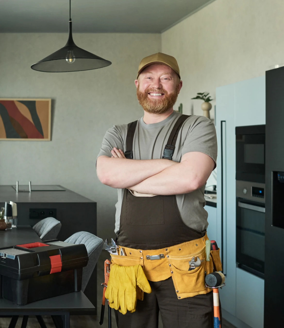 Happy worker standing in kitchen